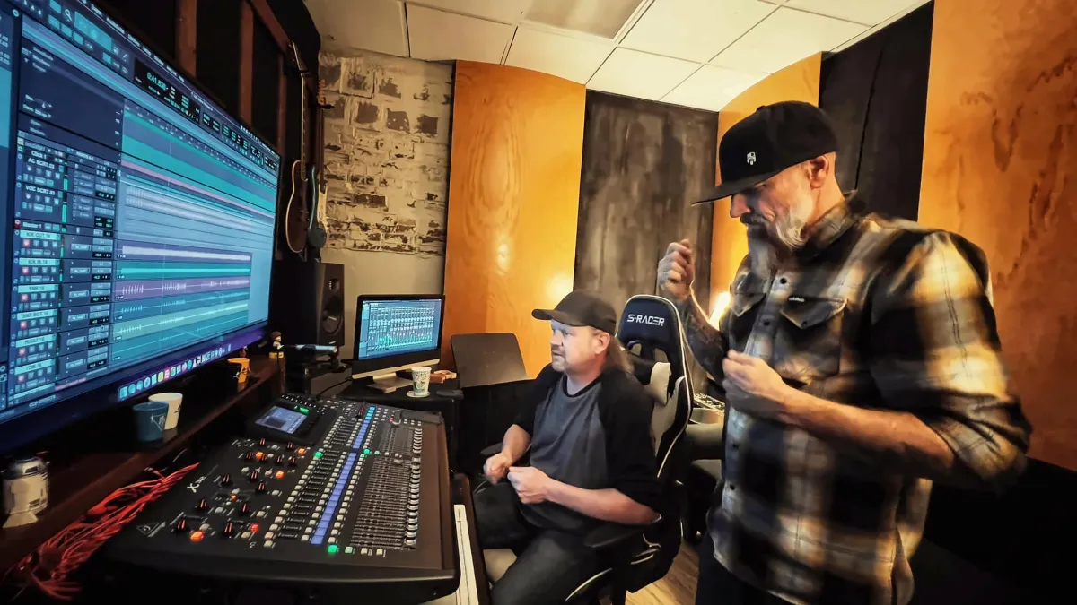 A session in a wood-paneled control room at KRM Studios